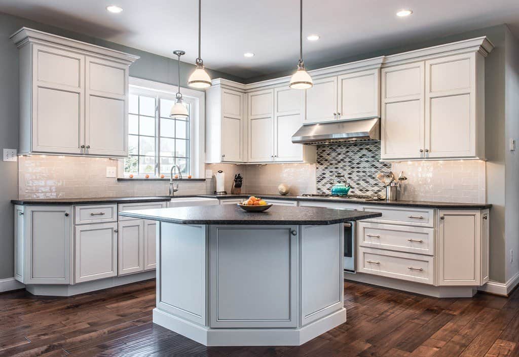Two-tone kitchen remodel with dark granite island and mosaic backsplash in Berwyn, PA by Fedor Fabrication