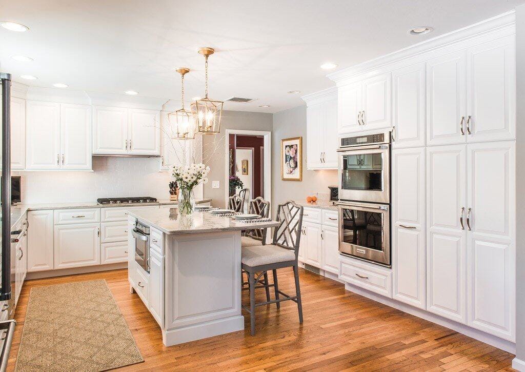 White shaker cabinet kitchen remodel with island and pendant lighting in West Chester, PA by Fedor Fabrication