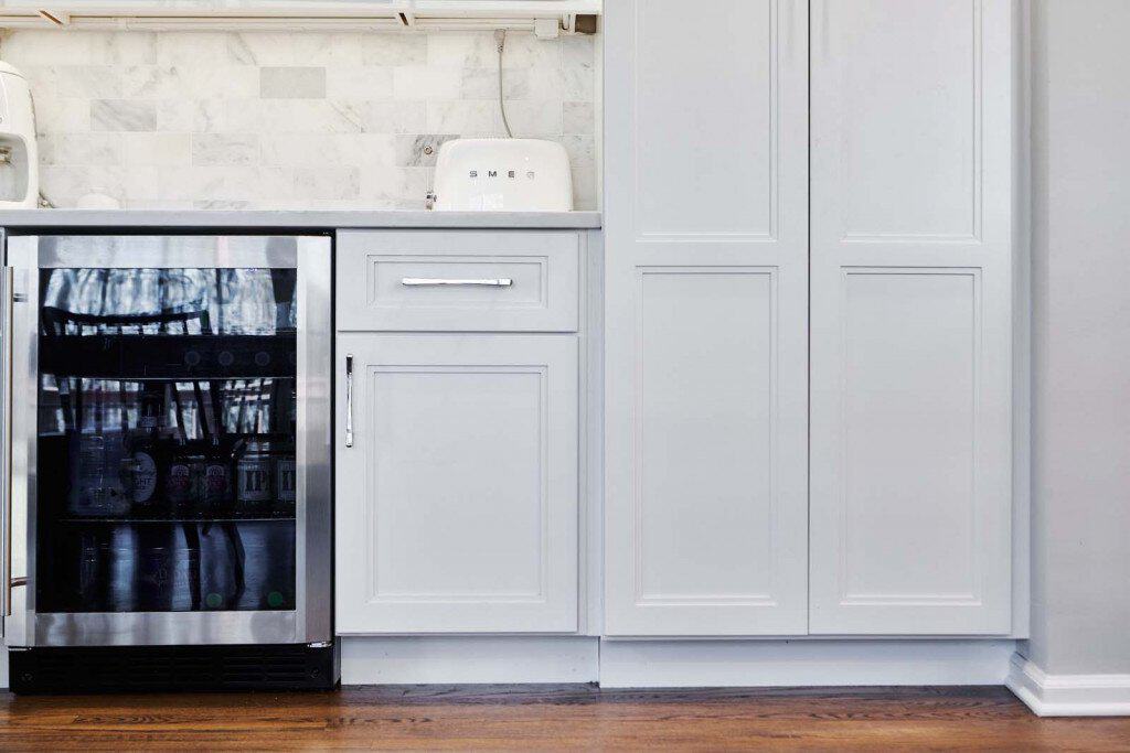 Beverage Fridge in Ardmore, PA kitchen remodel — White Shaker cabinetry