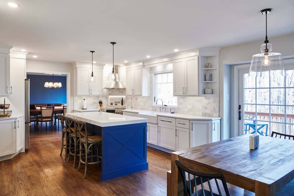 White Shaker cabinetry kitchen with cobalt blue X-pattern island and Carrara marble in Ardmore, PA — kitchen remodel by Fedor Fabrication
