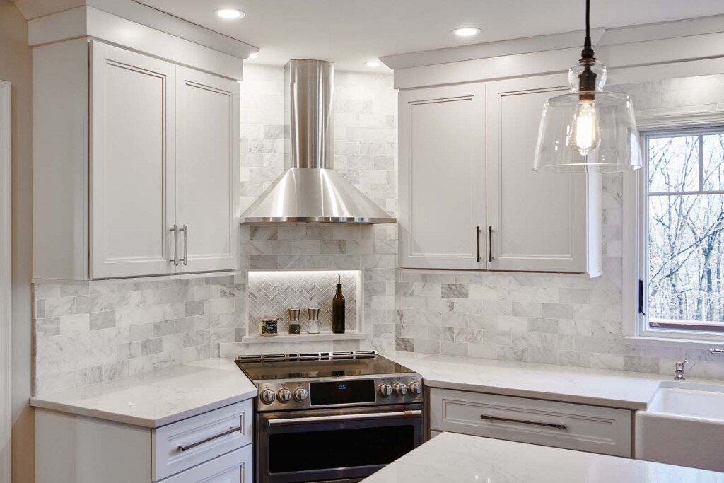 Herringbone Niche in Ardmore, PA kitchen remodel — White Shaker cabinetry