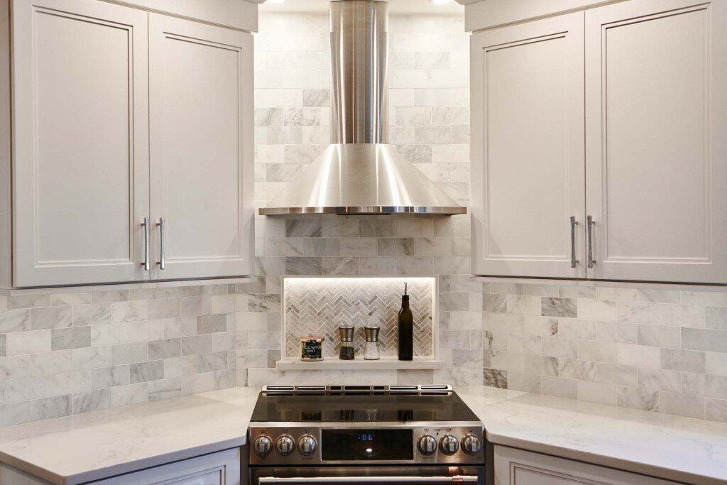Marble Backsplash in Ardmore, PA kitchen remodel — White Shaker cabinetry