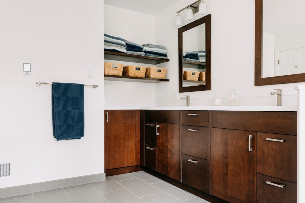 Bathroom remodel with a walnut vanity in Ardmore, PA — by Fedor Fabrication