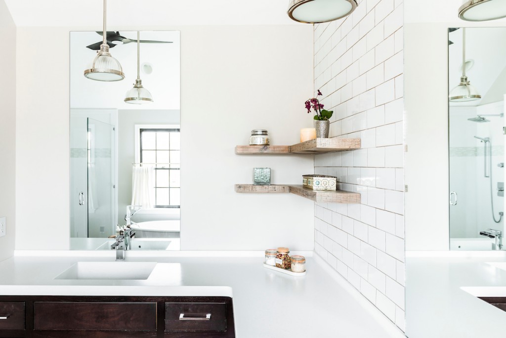 Reclaimed wood floating corner shelves with subway tile in Berwyn, PA bathroom remodel — Espresso inset Shaker double vanity, Corian