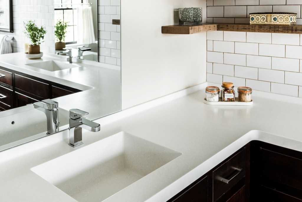 Undermount sink with quartz countertop in Berwyn, PA bathroom remodel — Espresso inset Shaker double vanity, Corian