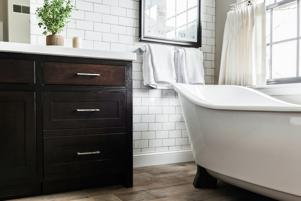Espresso Shaker vanity drawer detail with chrome pulls in Berwyn, PA bathroom remodel — Espresso inset Shaker double vanity, Corian