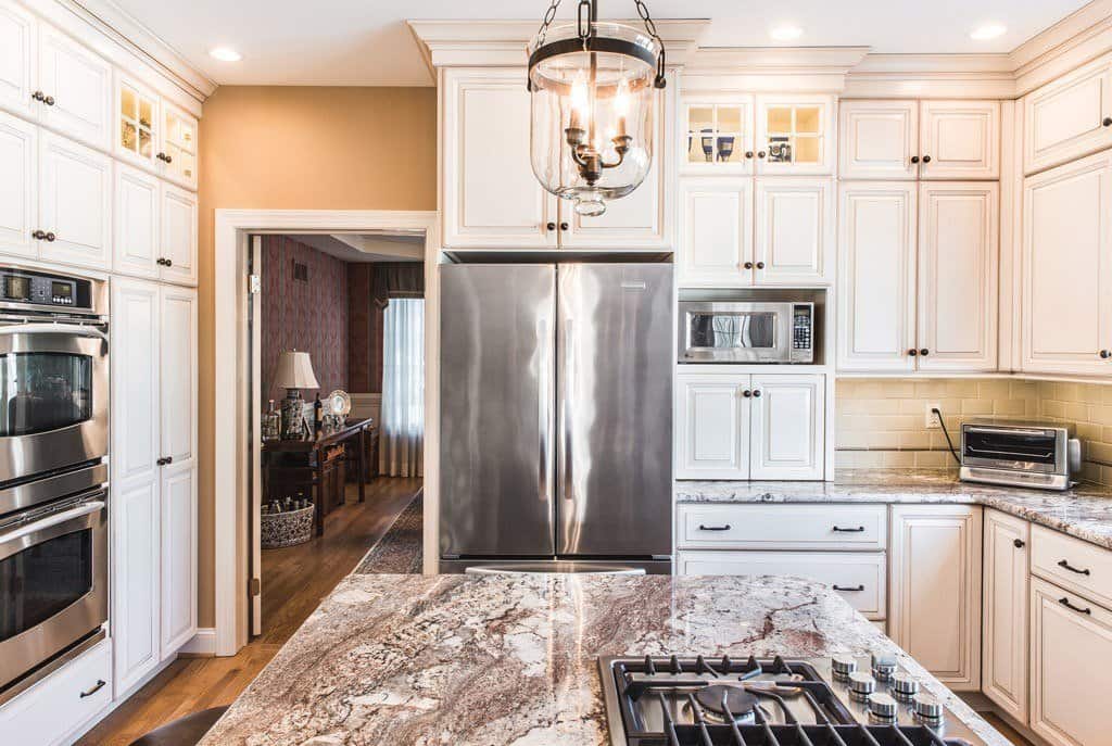 Glass Pendants in Berwyn, PA kitchen remodel — Cream raised-panel cabinetry