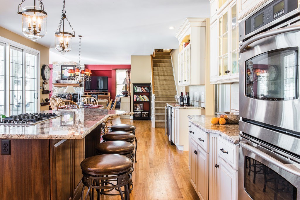 Walnut Island in Berwyn, PA kitchen remodel — Cream raised-panel cabinetry