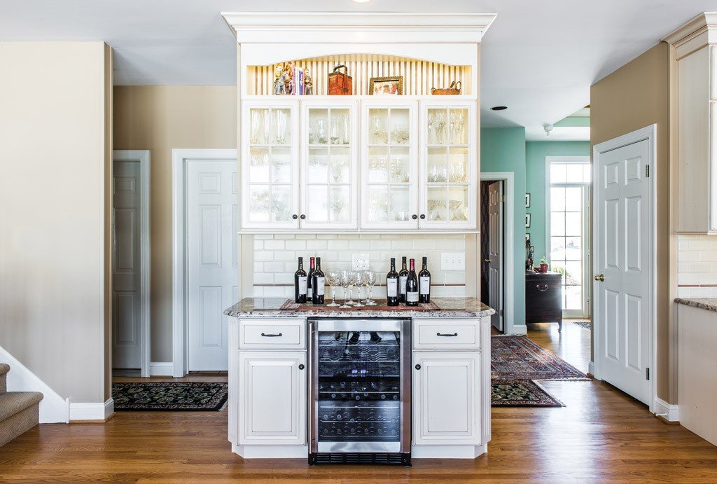 Wine Bar in Berwyn, PA kitchen remodel — Cream raised-panel cabinetry