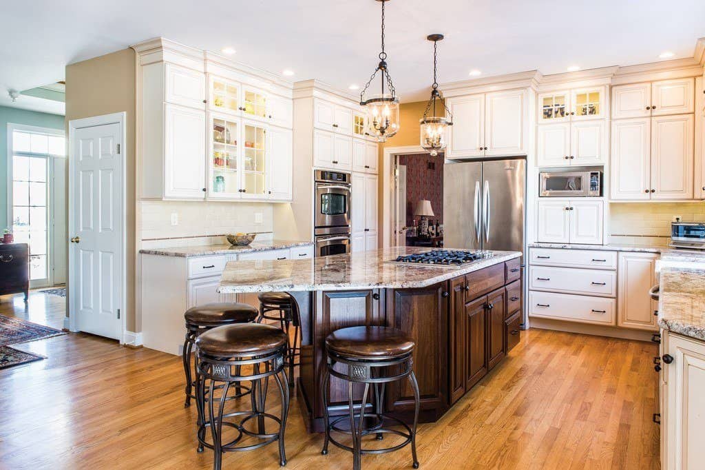 Traditional center-hall kitchen opened to the breakfast room with a walnut island in Berwyn, PA — kitchen remodel by Fedor Fabrication
