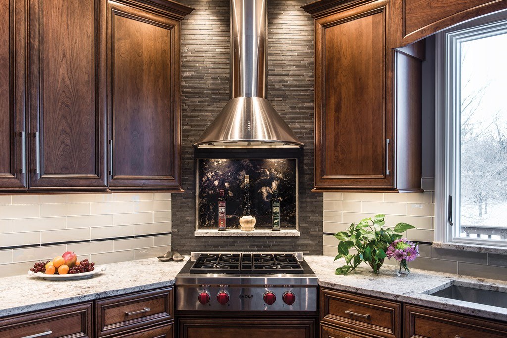 Stone Backsplash in Downingtown, PA kitchen remodel — Two-tone raised-panel cabinetry