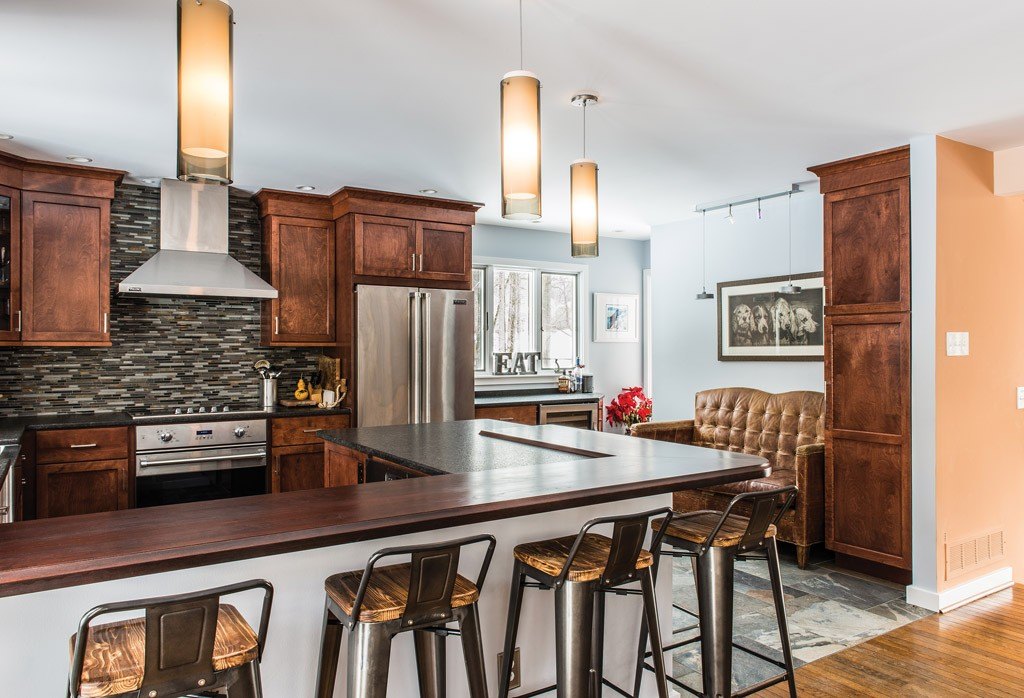 Stained cherry Shaker cabinetry kitchen with stainless wall hood and glass mosaic backsplash in Exton, PA — kitchen remodel by Fedor Fabrication