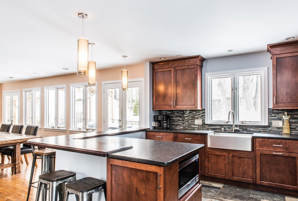 Window Wall in Exton, PA kitchen remodel — Stained cherry Shaker cabinetry