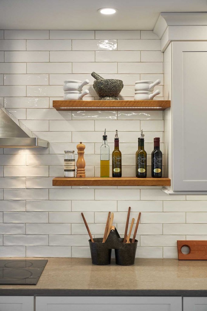 Exton Nordic kitchen detail of the matte black hardware on white Shaker frameless drawer fronts