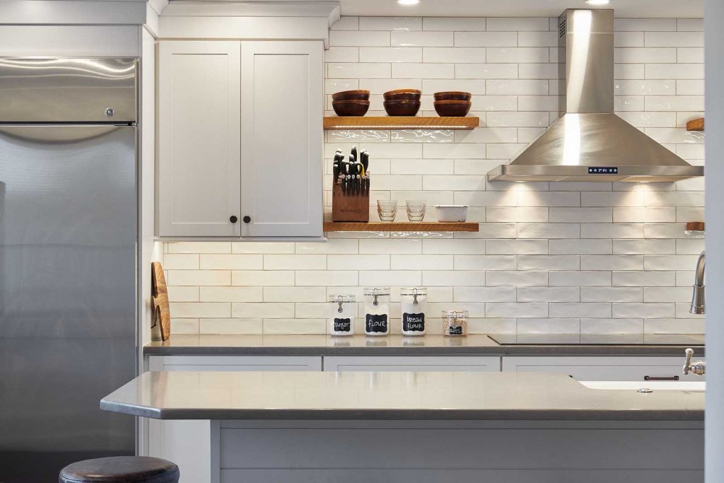 Exton kitchen wide view from the dining side showing the long single-wall layout and parallel island