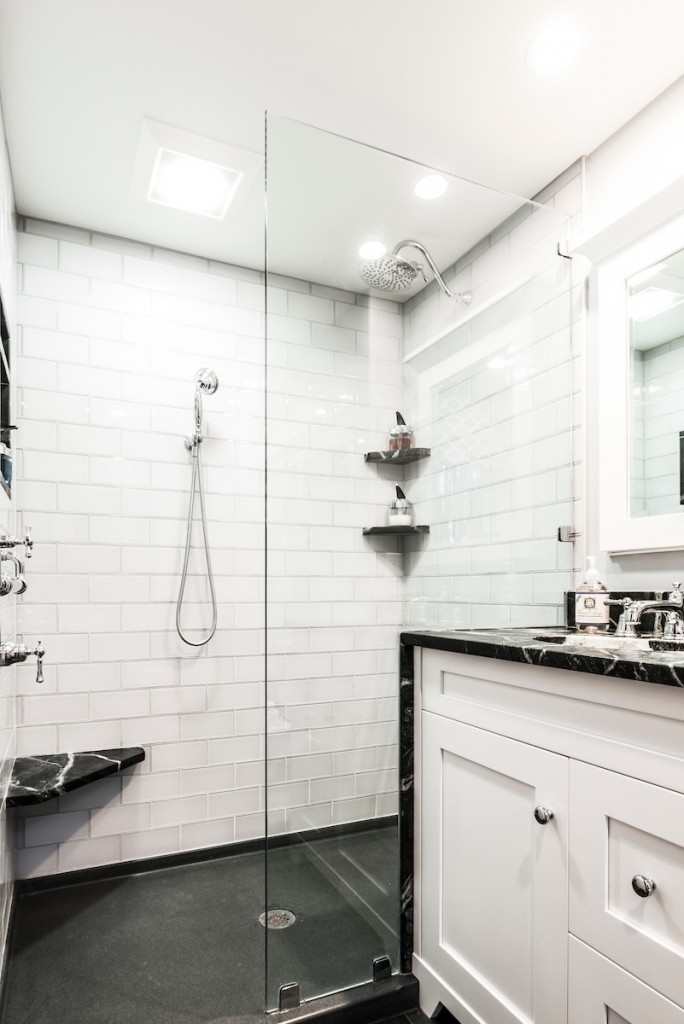 Frameless glass shower with rain head and handheld in Kennett Square, PA bathroom remodel — White Shaker vanity