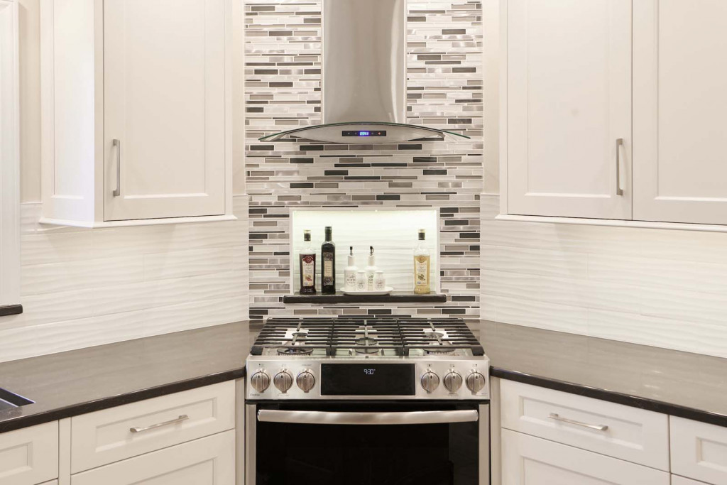 Stainless Range in Kennett Square, PA kitchen remodel — White Shaker cabinetry