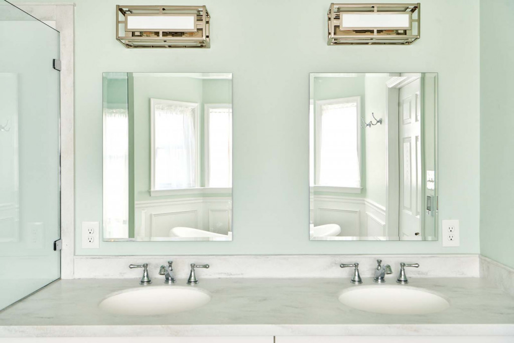 Carrara marble countertop with double undermount sinks in Malvern, PA bathroom remodel — Mint primary bath