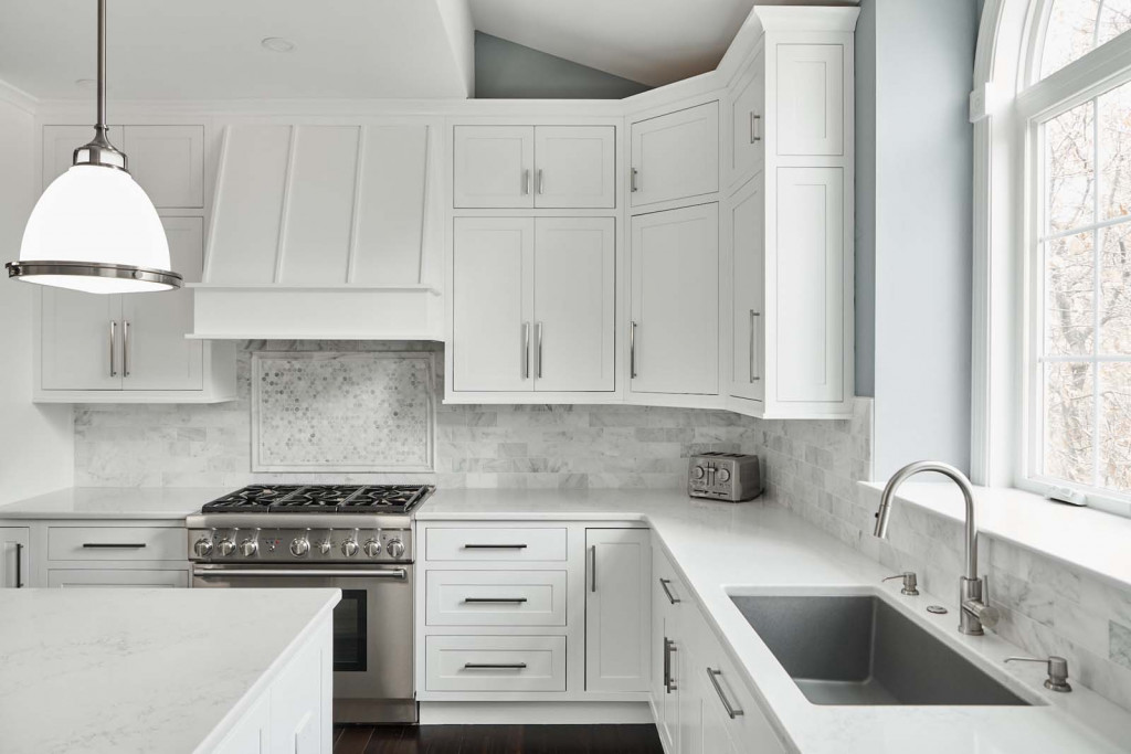 Range Corner in Malvern, PA kitchen remodel — White inset Shaker cabinetry