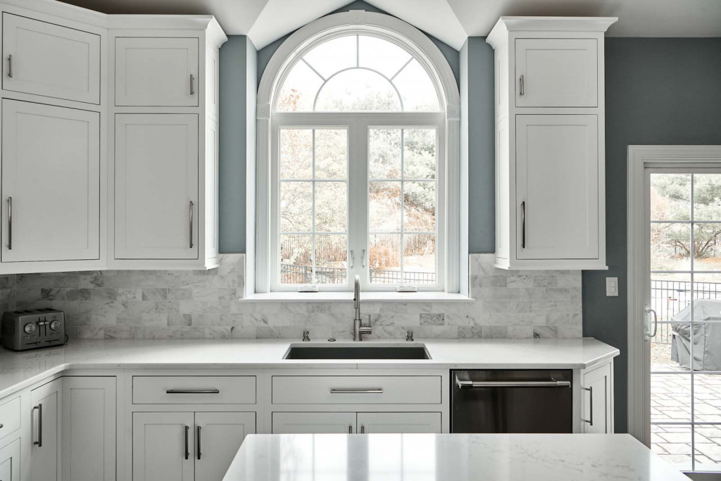 Sink Arch in Malvern, PA kitchen remodel — White inset Shaker cabinetry