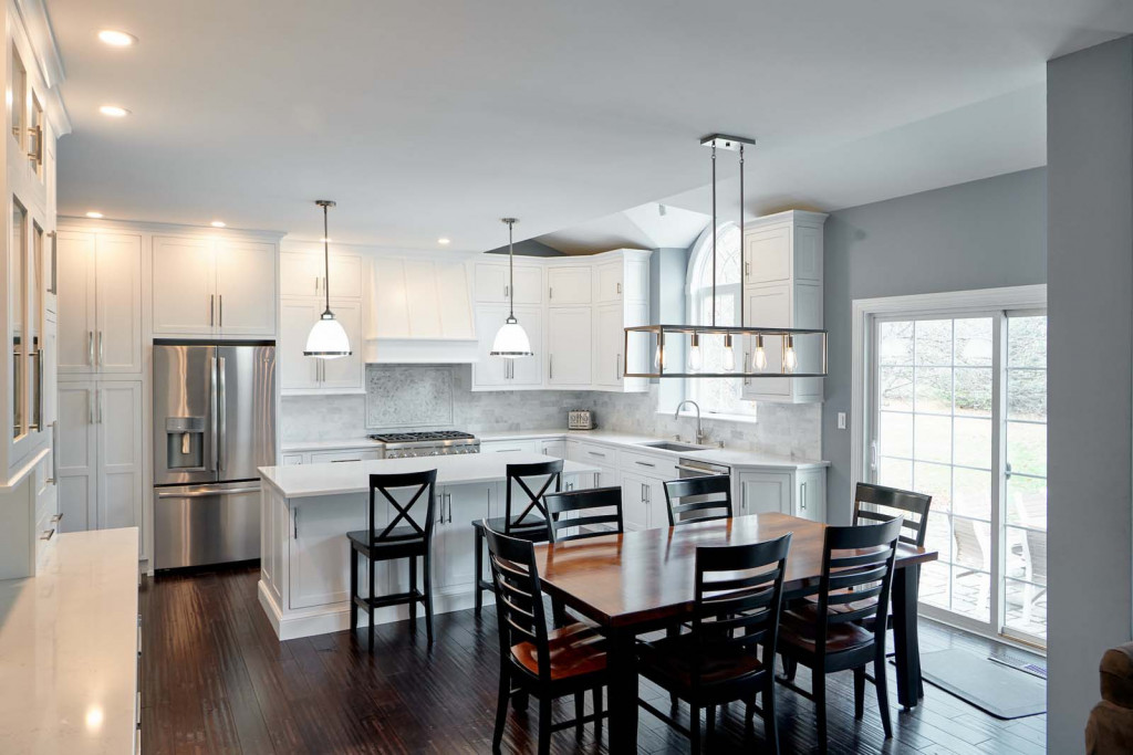 Walnut Table in Malvern, PA kitchen remodel — White inset Shaker cabinetry