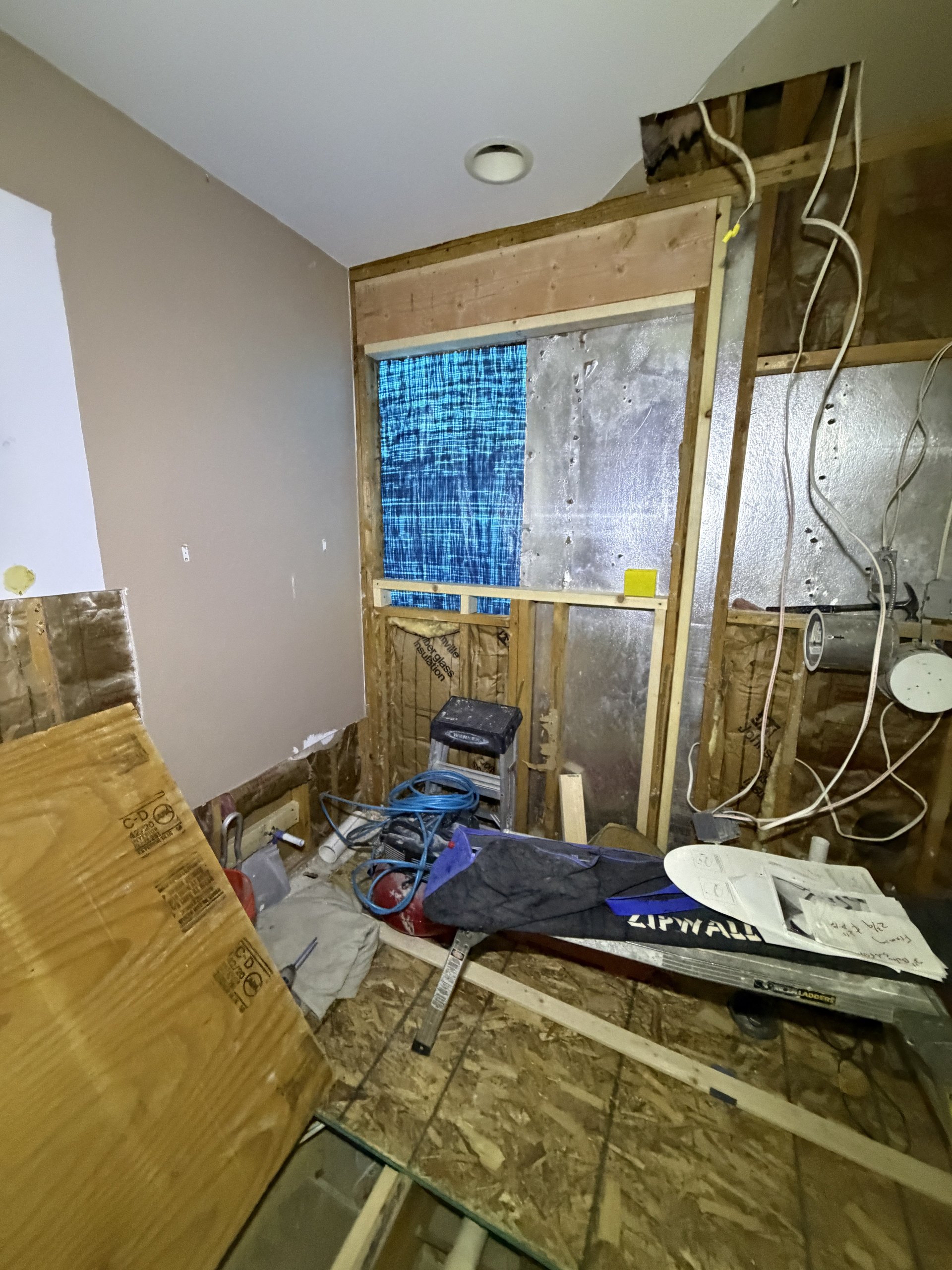 New framing, insulation, and wall waterproofing in progress