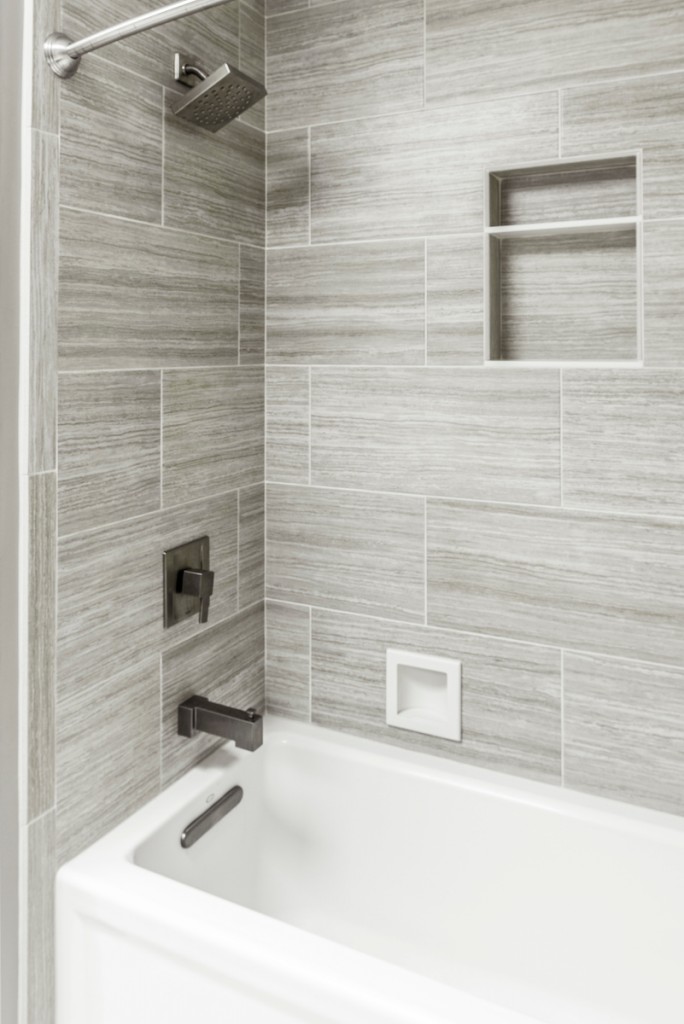 Gray plank-tile alcove tub surround vertical in Media, PA bathroom remodel — Espresso Shaker vanity
