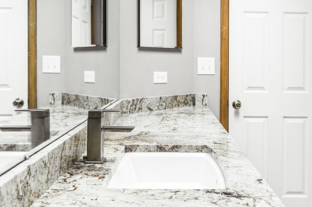 Media granite vanity bathroom remodel