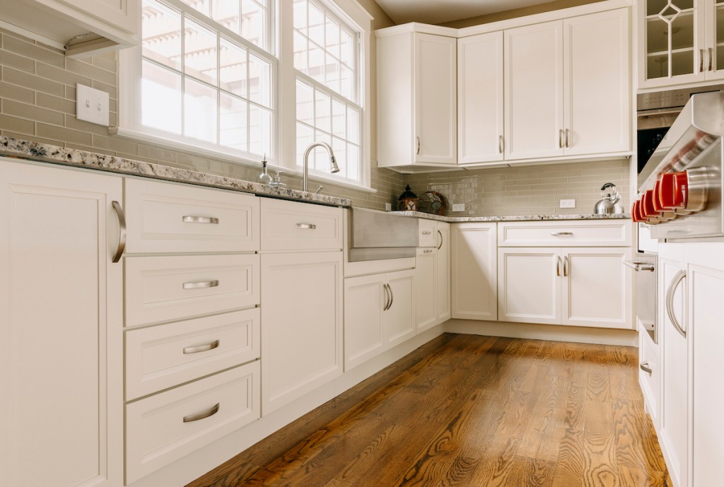 Farmhouse Sink in Media, PA kitchen remodel — White recessed-panel cabinetry