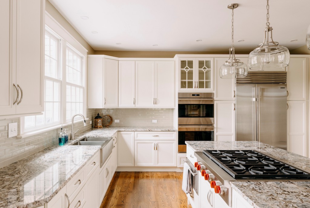 Globe Pendants in Media, PA kitchen remodel — White recessed-panel cabinetry