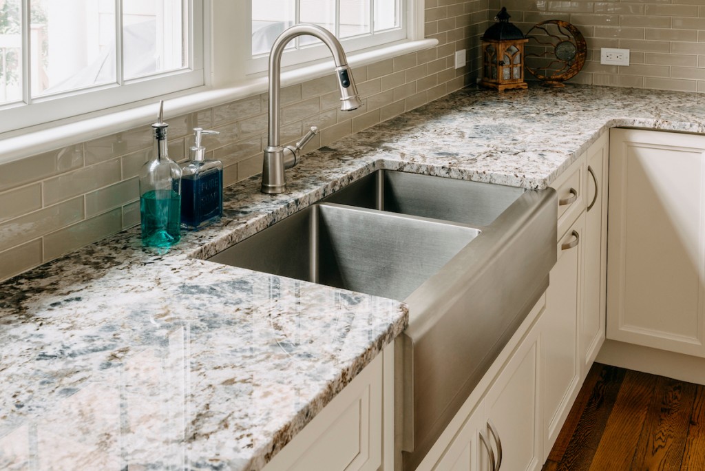 Stainless Sink in Media, PA kitchen remodel — White recessed-panel cabinetry