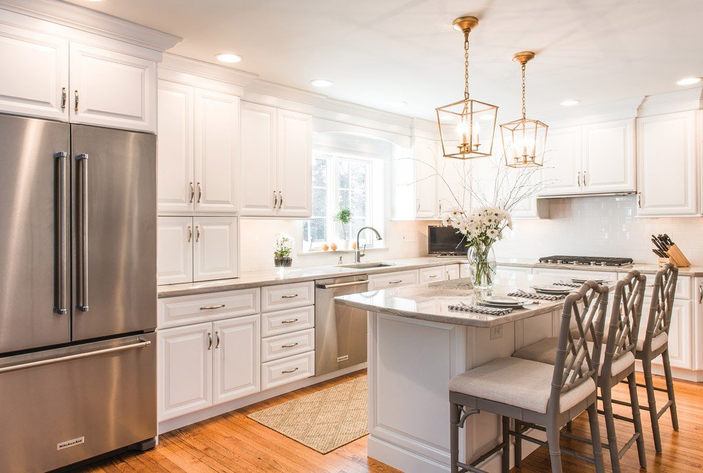 French Fridge in Newtown Square, PA kitchen remodel — Cream raised-panel cabinetry