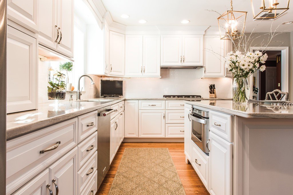 Galley View in Newtown Square, PA kitchen remodel — Cream raised-panel cabinetry