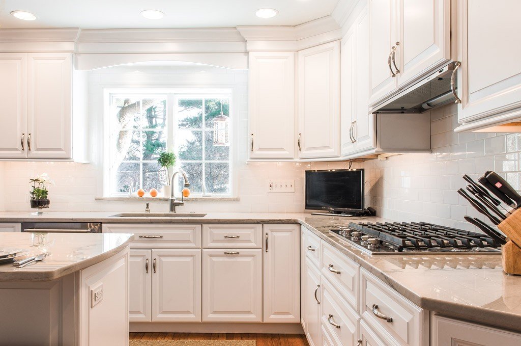 Gas Cooktop in Newtown Square, PA kitchen remodel — Cream raised-panel cabinetry