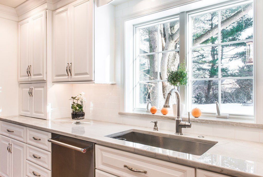 Window Sink in Newtown Square, PA kitchen remodel — Cream raised-panel cabinetry