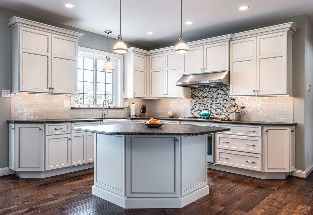 Cream glazed Shaker cabinetry kitchen with octagonal island and scalloped glass mosaic in Paoli, PA — kitchen remodel by Fedor Fabrication
