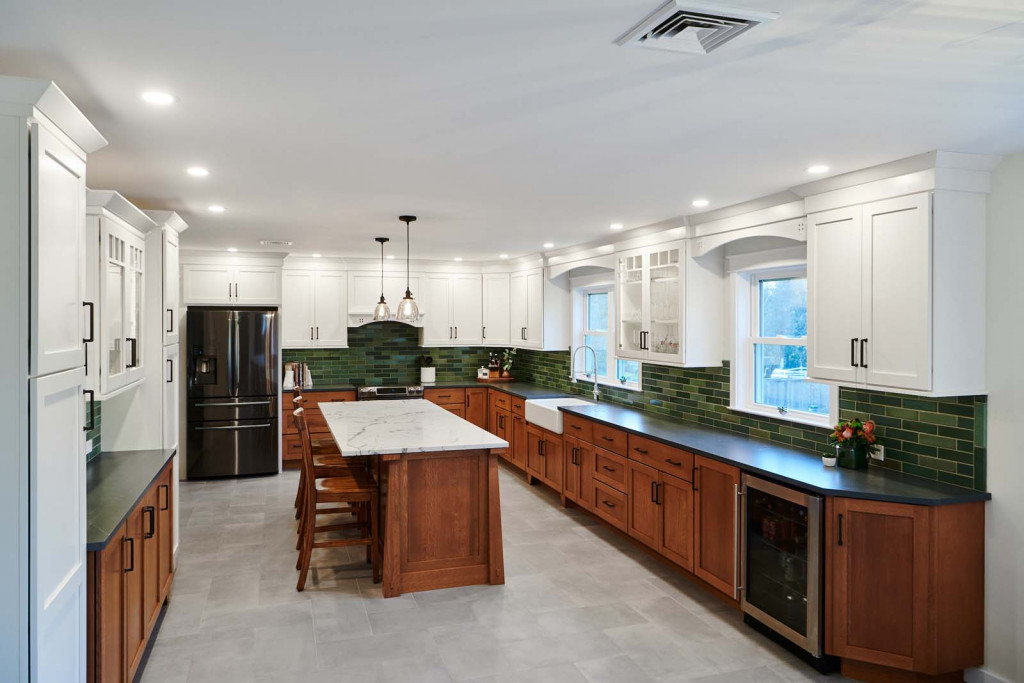 Two-tone Shaker cabinetry kitchen with stained cherry island and deep-green subway in Phoenixville, PA — kitchen remodel by Fedor Fabrication