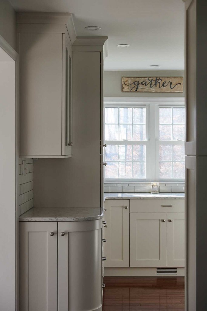 Villanova kitchen sink-window view with fireclay farmhouse sink and dark-grout subway tile