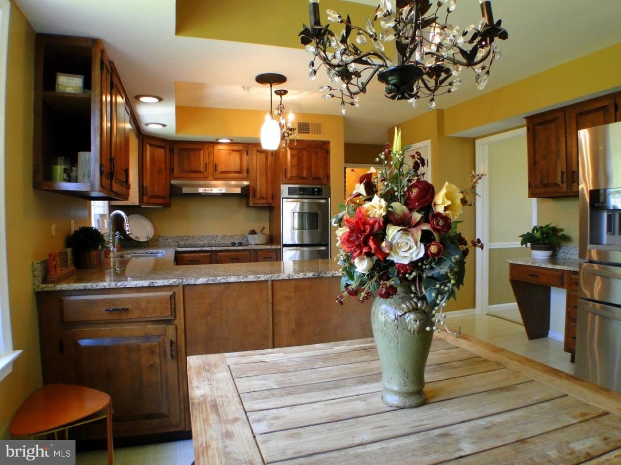 Villanova kitchen before — view from the breakfast area looking back at the original peninsula and golden oak cabinets