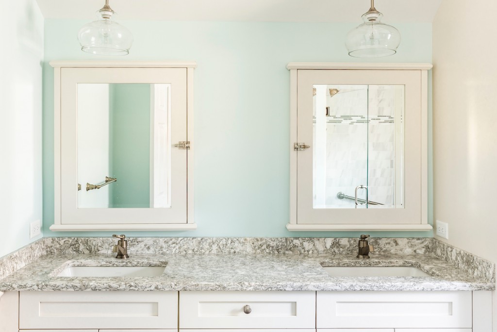 White Shaker cabinetry double vanity with seafoam beadboard wainscot and marble subway shower in West Chester, PA — primary bath remodel by Fedor Fabrication