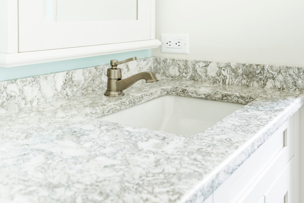 White-and-gray veined quartz countertop detail in West Chester, PA bathroom remodel — Coastal seafoam primary