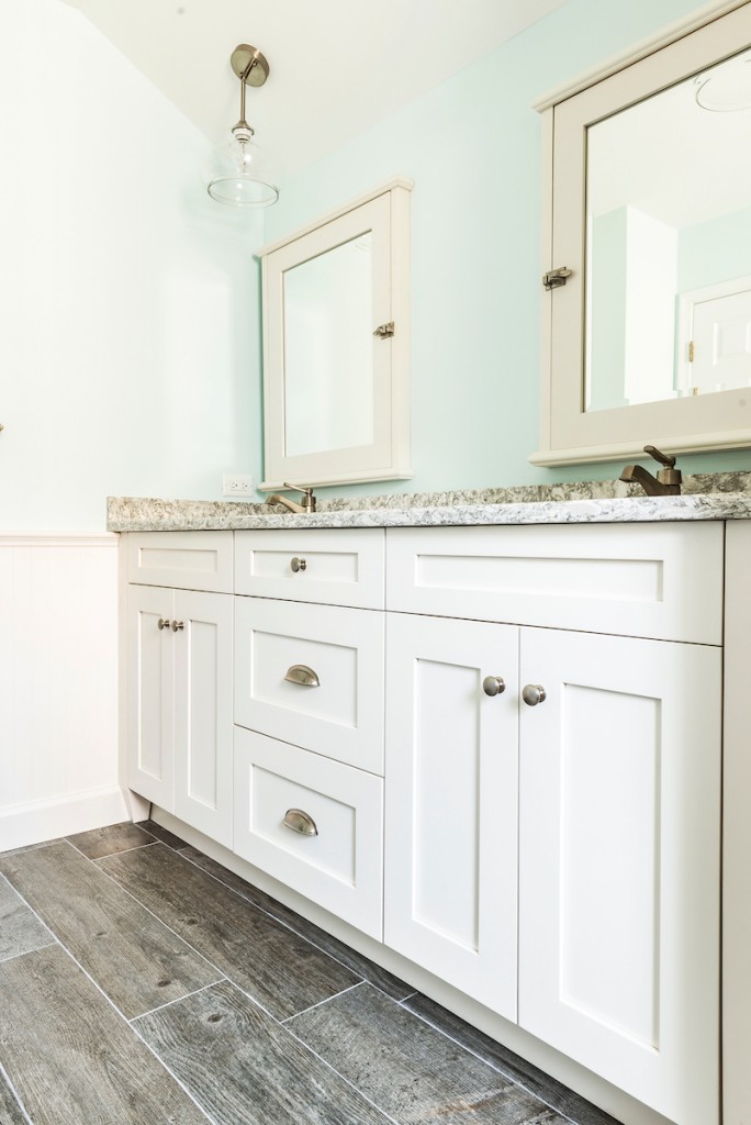 White Shaker double vanity vertical view in attic primary in West Chester, PA bathroom remodel — Coastal seafoam primary