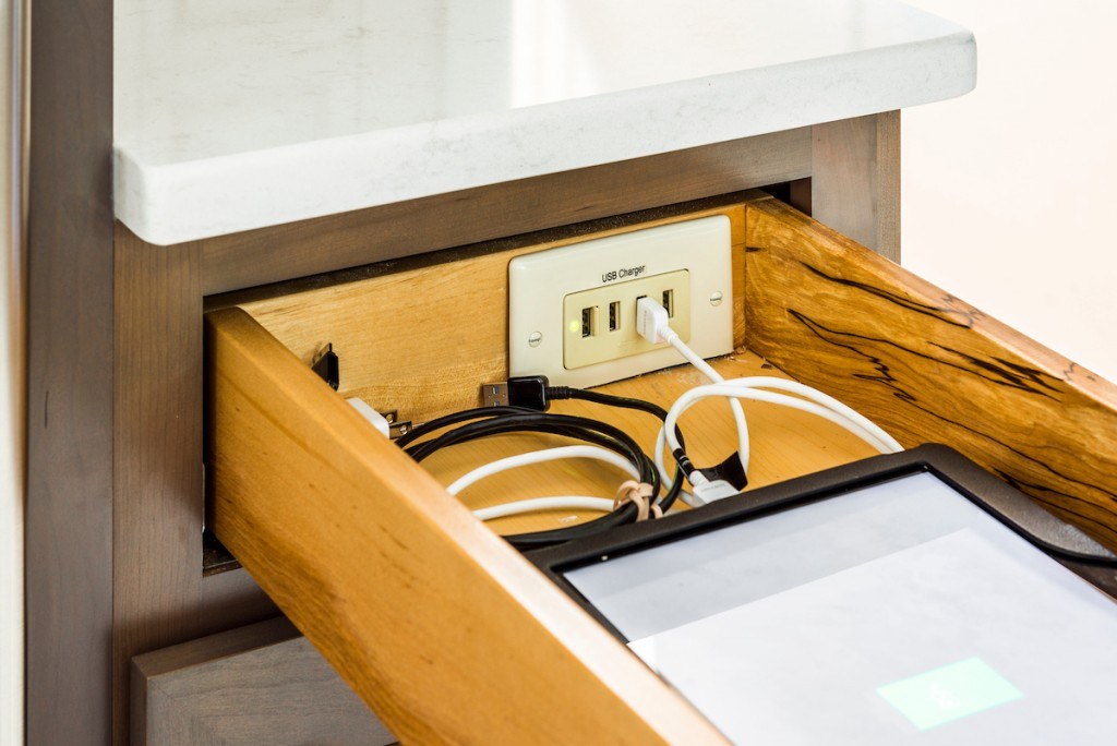West Chester kitchen docking drawer open showing in-drawer USB charging receptacle and concealed device storage