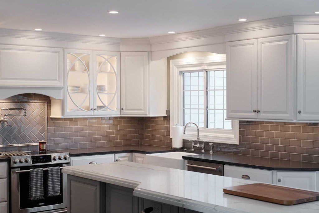 West Chester kitchen wide angle showing the relationship between the white perimeter cabinets and the pale-blue island