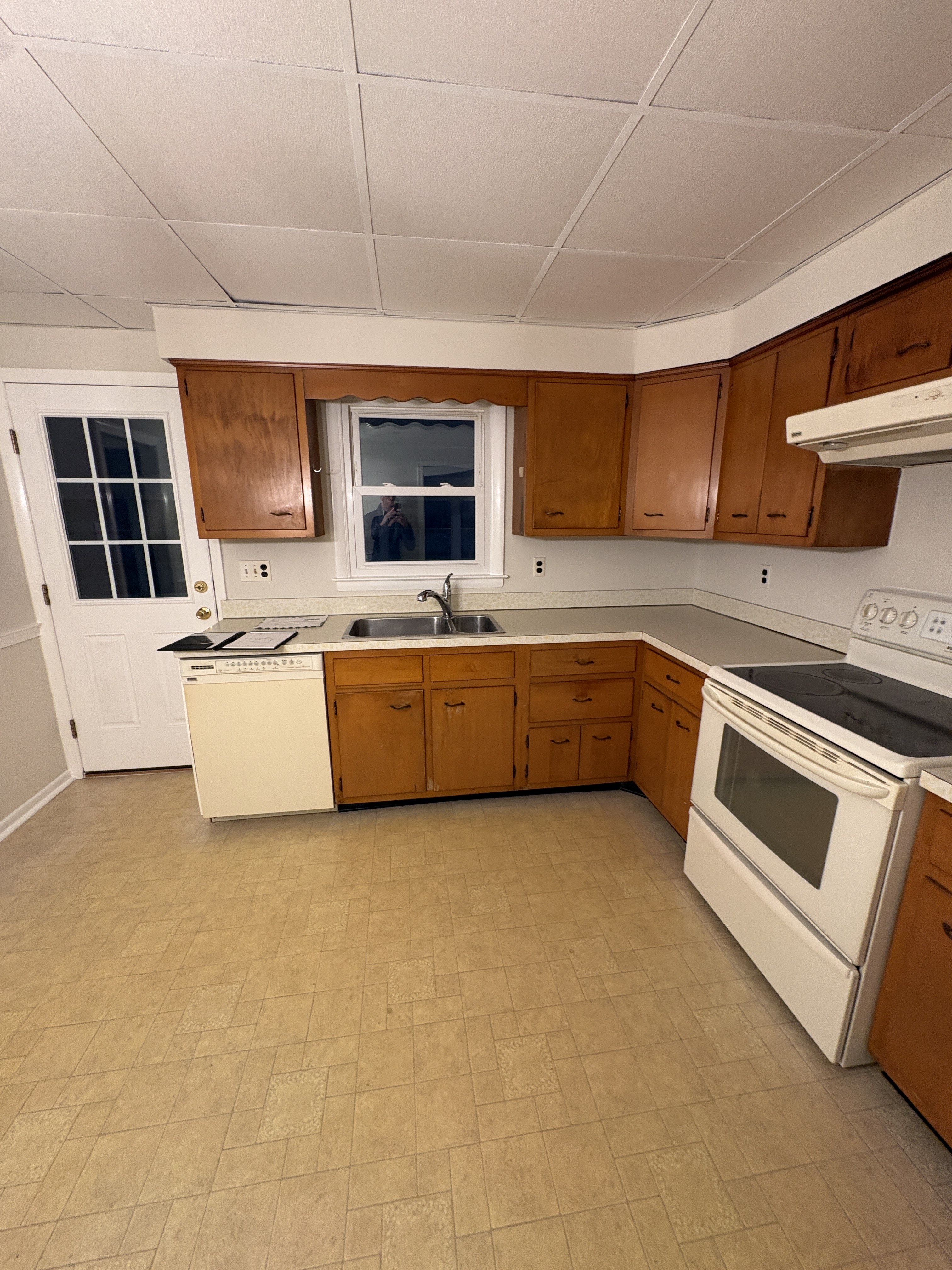 Original cabinet wall and narrow doorway — West Chester kitchen before two-tone Shaker remodel