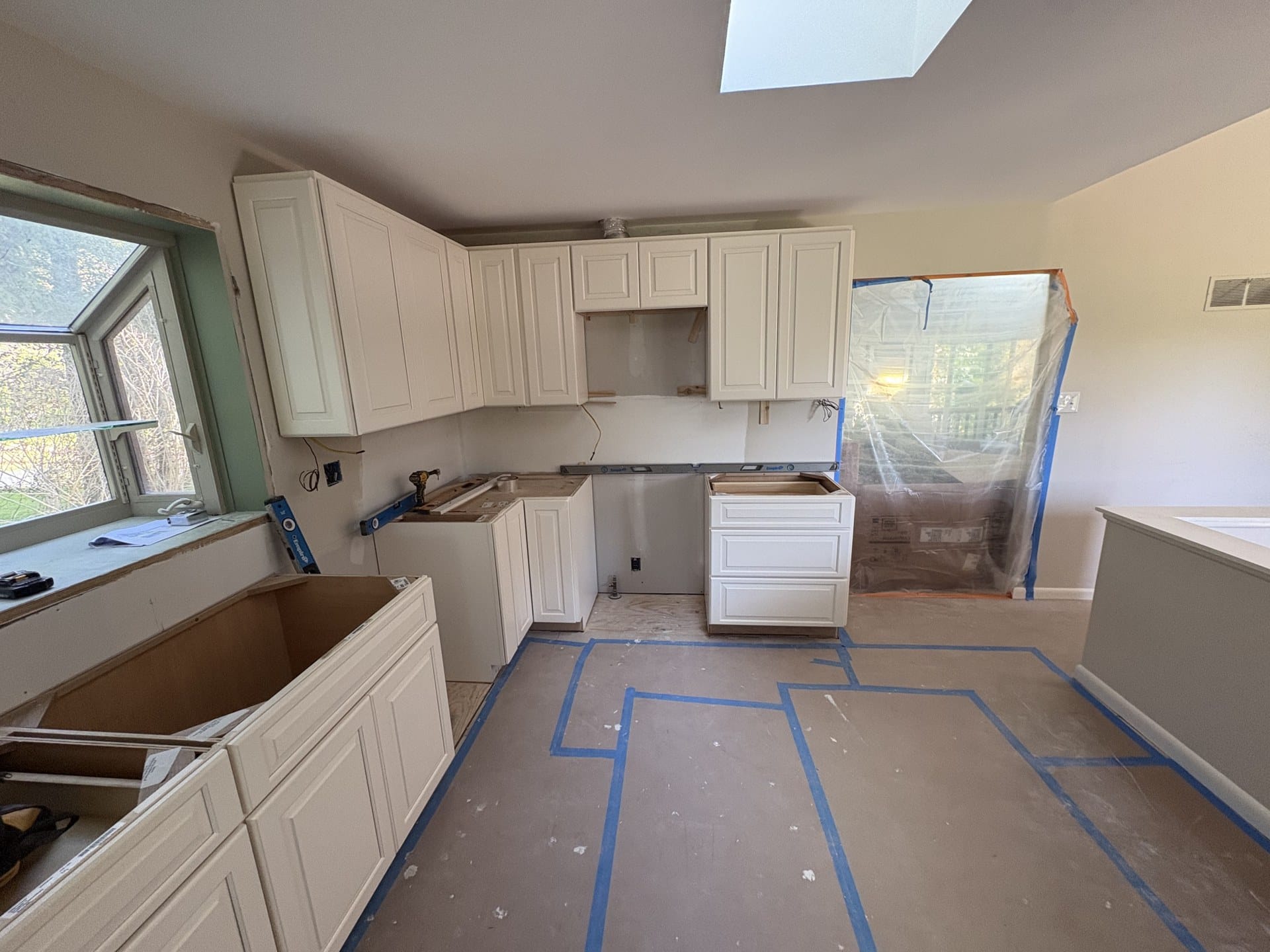 New cabinets being installed during a Chester Springs kitchen remodel