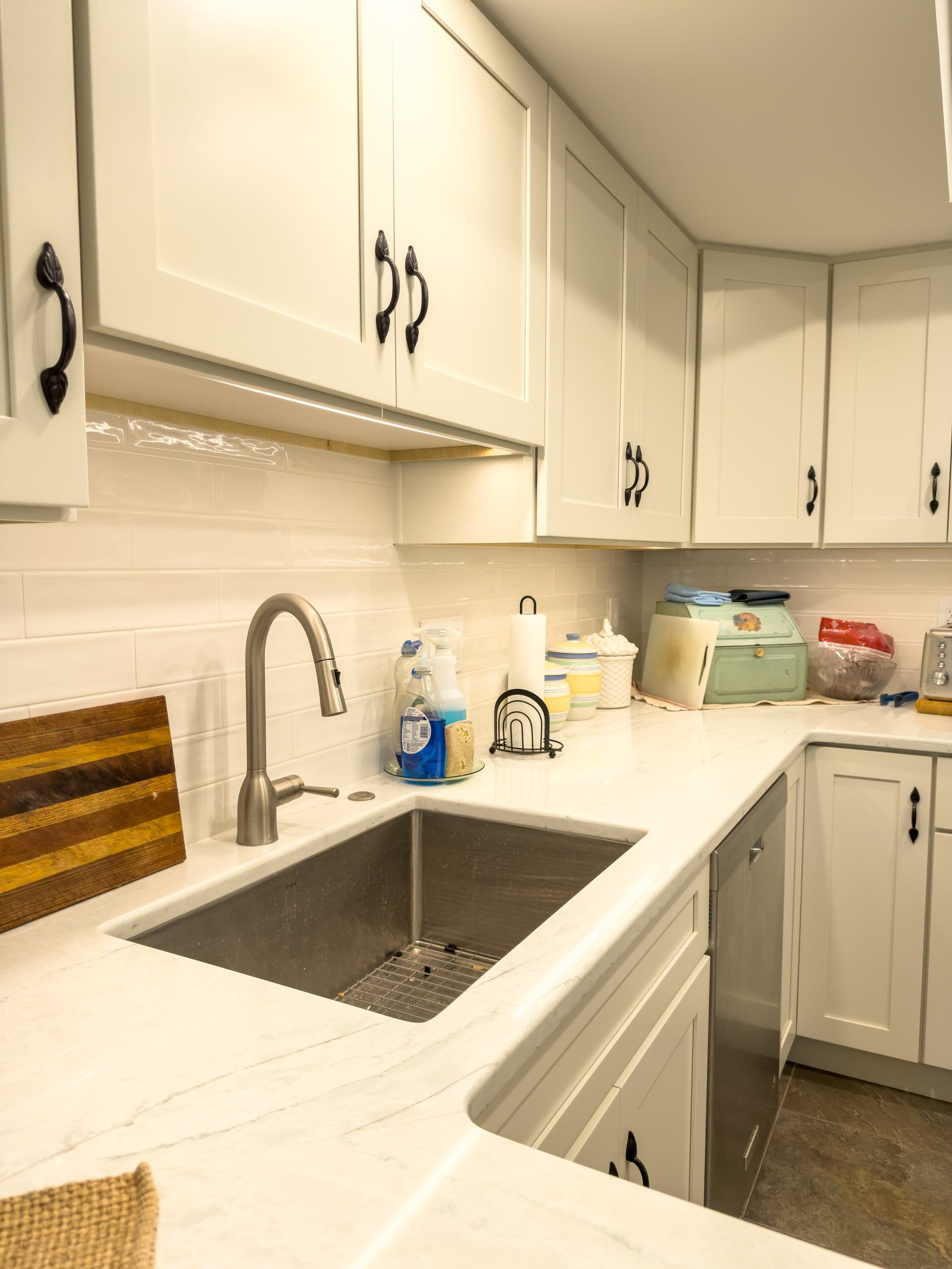 Marble-look Vicostone Beryl quartz countertop and stainless sink detail