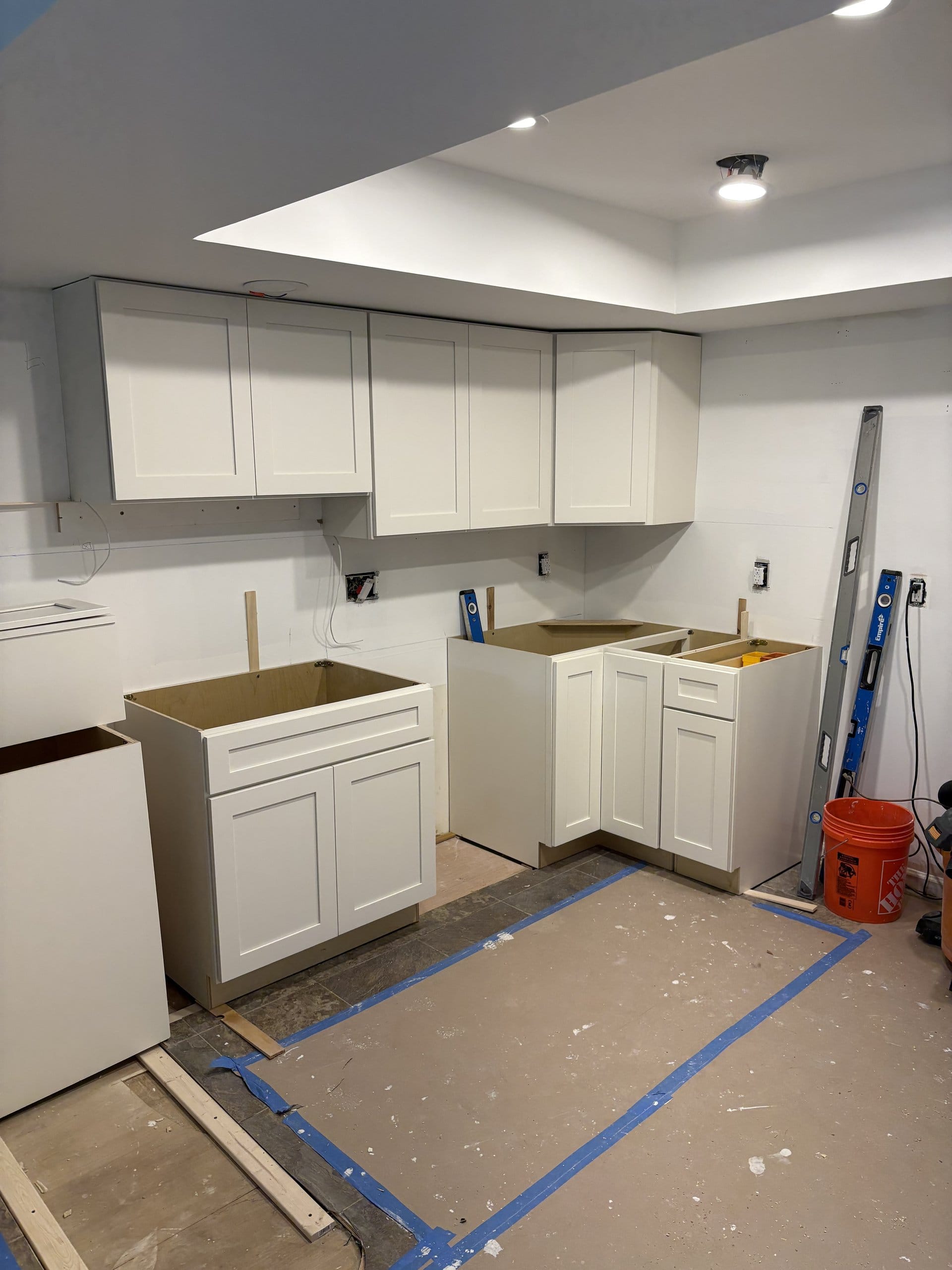 Cabinet installation in progress around the peninsula